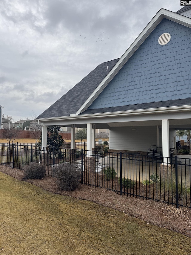 view of property exterior with a lawn