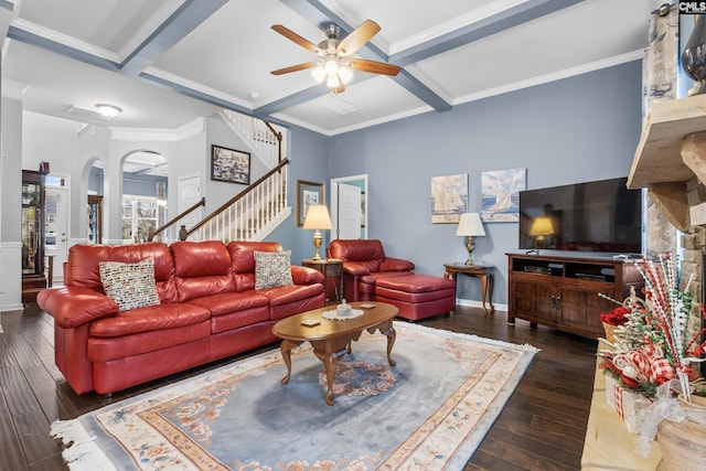 living room featuring dark hardwood / wood-style floors, ceiling fan, crown molding, and coffered ceiling