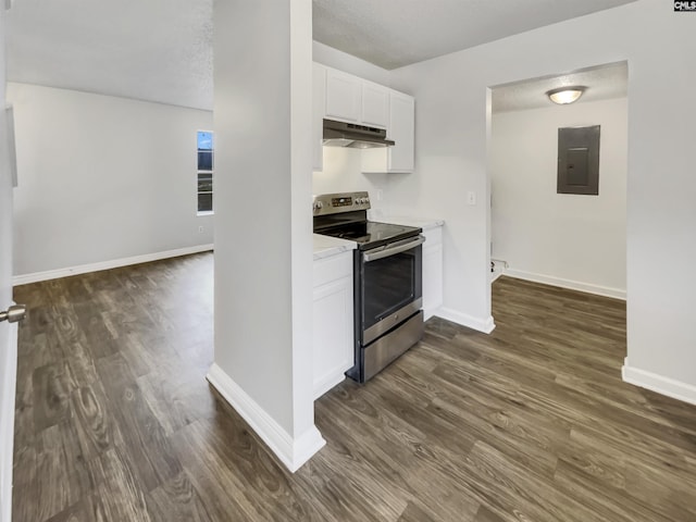 kitchen featuring dark wood-type flooring, electric panel, a textured ceiling, stainless steel range with electric stovetop, and white cabinets