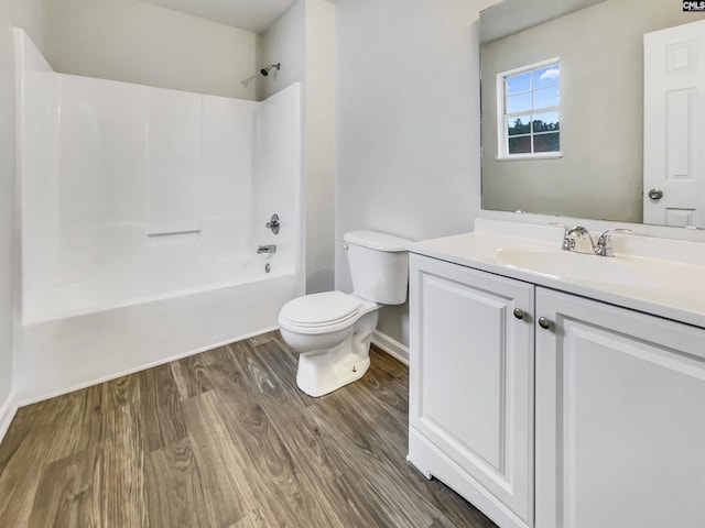 full bathroom featuring vanity, wood-type flooring, shower / bathtub combination, and toilet