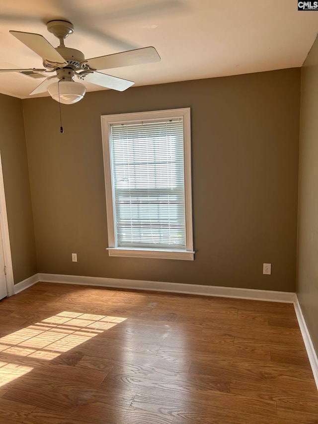 spare room featuring ceiling fan and light hardwood / wood-style flooring