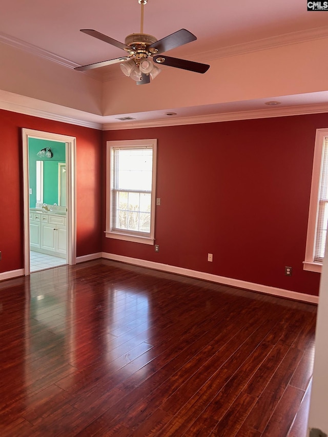 unfurnished room featuring dark hardwood / wood-style flooring, ceiling fan, and ornamental molding