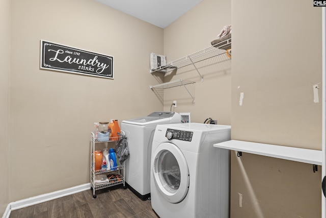 washroom featuring washer and clothes dryer and dark wood-type flooring