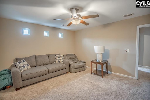 living room featuring ceiling fan and light carpet