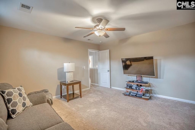 carpeted living room with ceiling fan