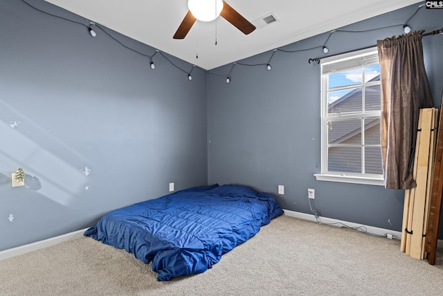 carpeted bedroom featuring ceiling fan