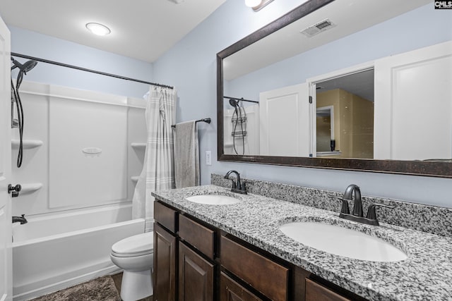 full bathroom featuring vanity, shower / bath combination with curtain, and toilet