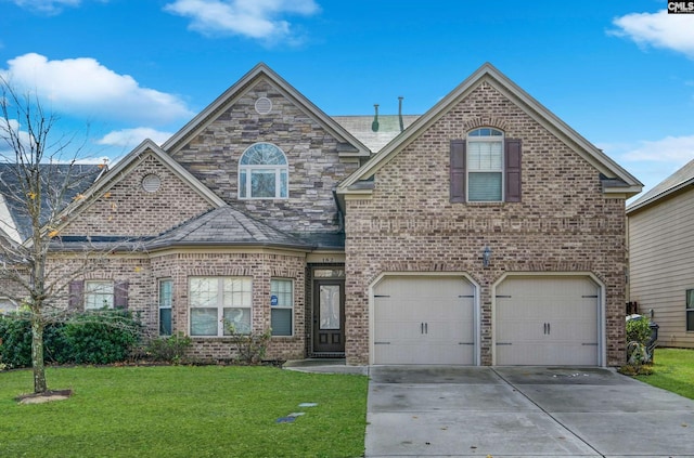 view of front property with a front yard and a garage