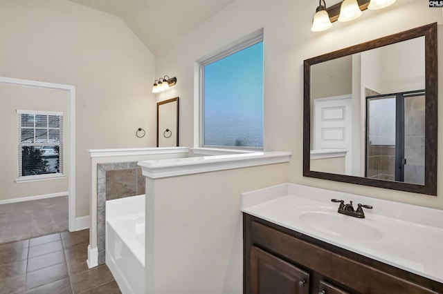 bathroom with tile patterned flooring, vanity, independent shower and bath, and vaulted ceiling