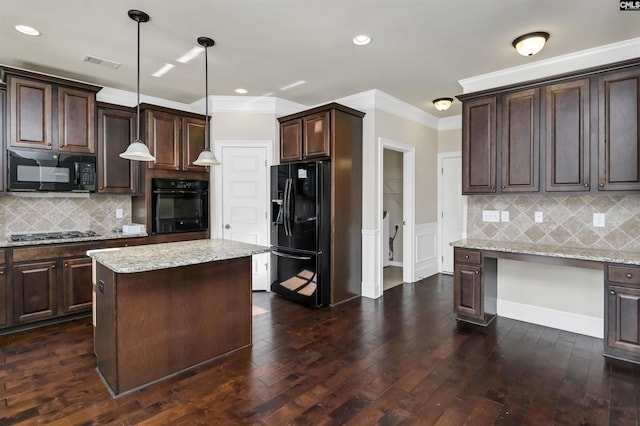 kitchen with dark hardwood / wood-style flooring, pendant lighting, dark brown cabinets, a kitchen island, and black appliances