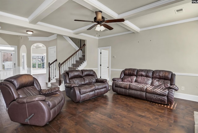 living room featuring beamed ceiling, dark hardwood / wood-style flooring, ceiling fan, and ornamental molding