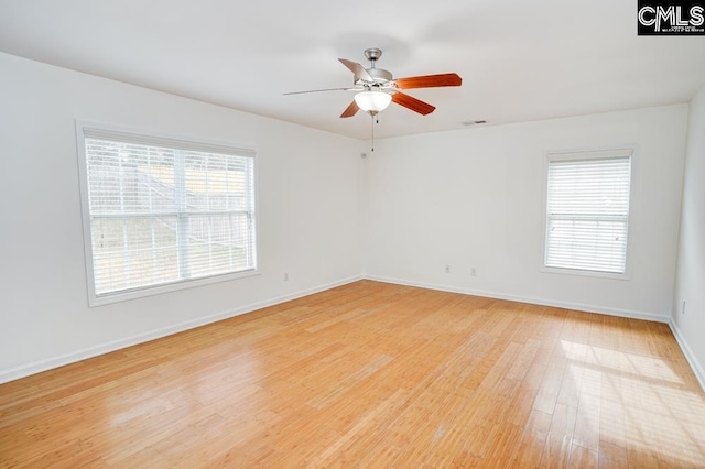 unfurnished room with ceiling fan and light hardwood / wood-style floors