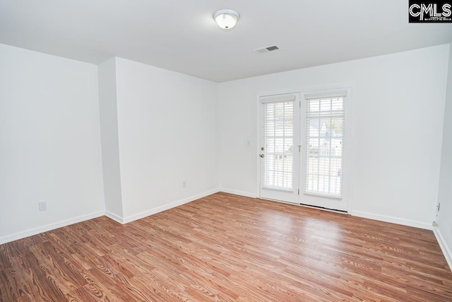 unfurnished room featuring light hardwood / wood-style floors