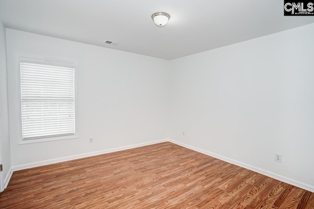 spare room featuring light hardwood / wood-style flooring