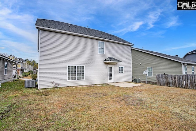 back of house featuring a yard, cooling unit, and a patio area