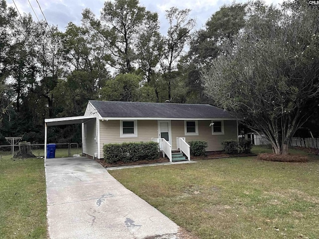 ranch-style home with a front yard and a carport