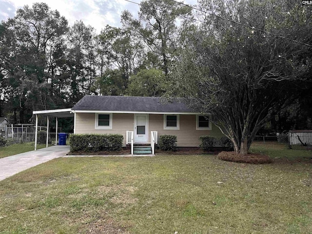 ranch-style home with a front yard and a carport