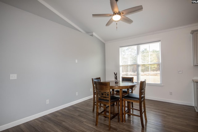 dining space with lofted ceiling, crown molding, ceiling fan, and dark wood-type flooring