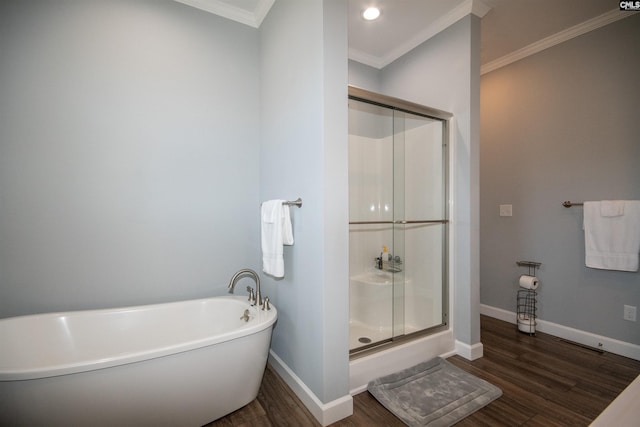 bathroom featuring hardwood / wood-style floors, shower with separate bathtub, and ornamental molding