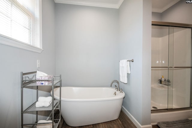 bathroom featuring plus walk in shower, wood-type flooring, and ornamental molding