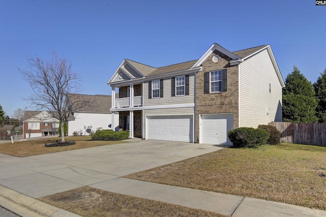 view of front of property with a front yard and a garage