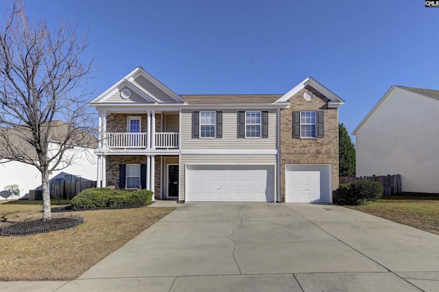 view of front of house featuring a balcony and a garage