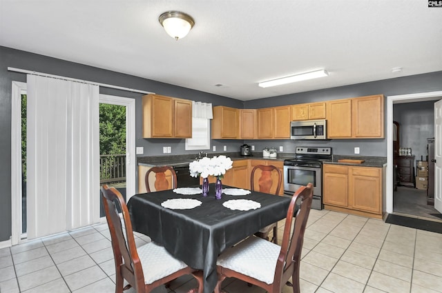 kitchen featuring appliances with stainless steel finishes and light tile patterned floors