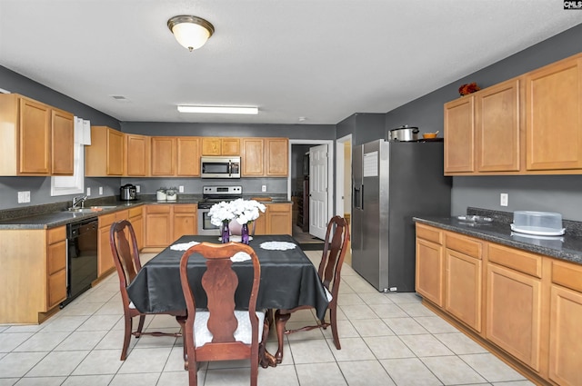 kitchen featuring sink, light tile patterned floors, and appliances with stainless steel finishes