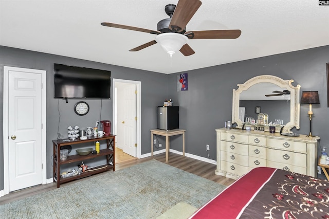 bedroom featuring ceiling fan and dark hardwood / wood-style flooring