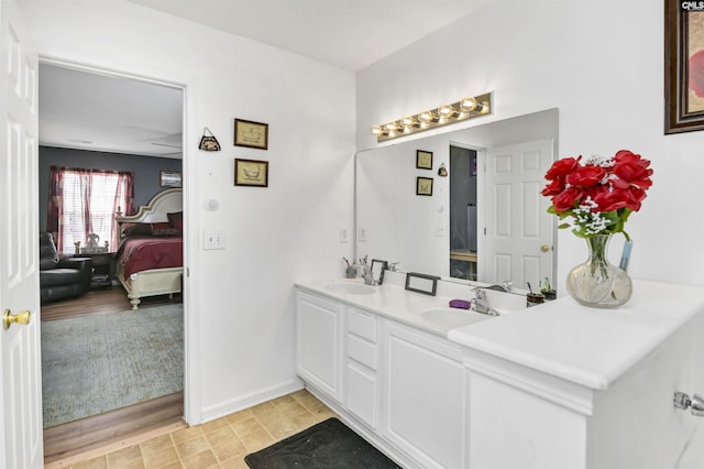 bathroom with vanity and hardwood / wood-style flooring