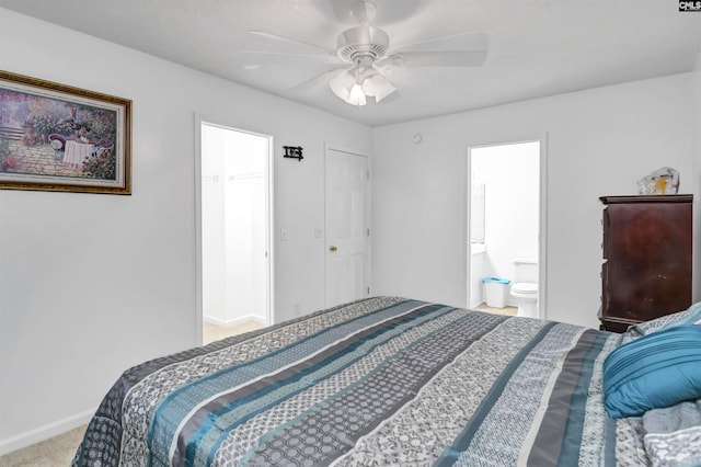 bedroom featuring light colored carpet, ensuite bath, a closet, and ceiling fan