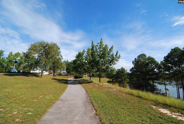 view of home's community with a yard and a playground