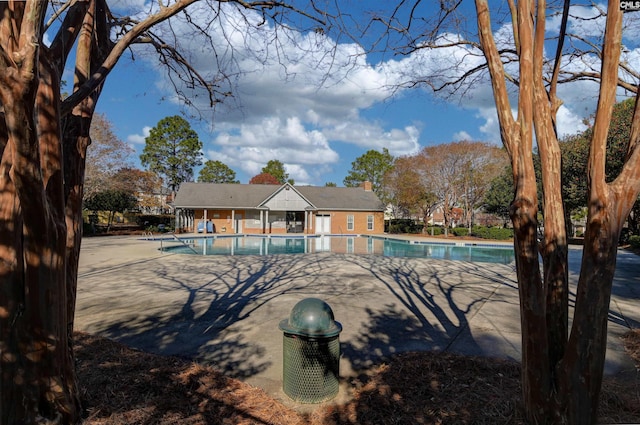 view of swimming pool featuring a patio area