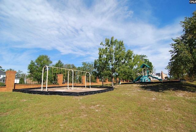 view of jungle gym featuring a lawn