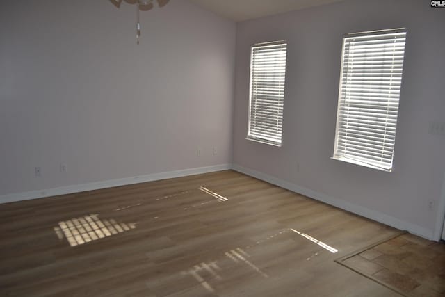 unfurnished room featuring hardwood / wood-style floors and ceiling fan