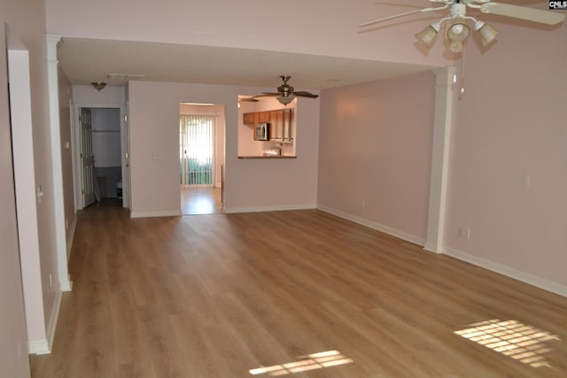 interior space with light hardwood / wood-style floors and ceiling fan