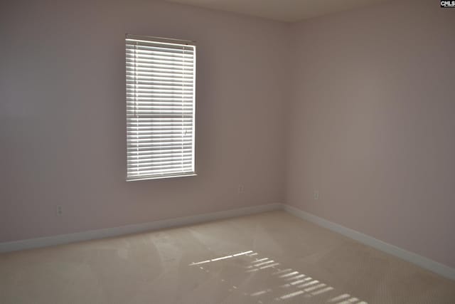 empty room with light colored carpet