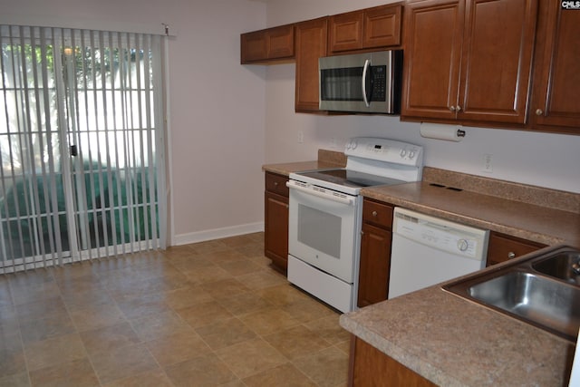 kitchen with sink and white appliances