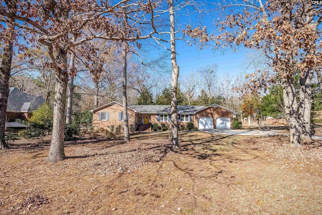 single story home featuring a garage