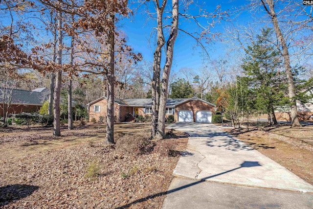 single story home with a garage