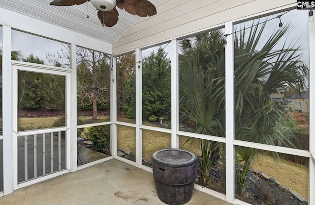 unfurnished sunroom featuring lofted ceiling