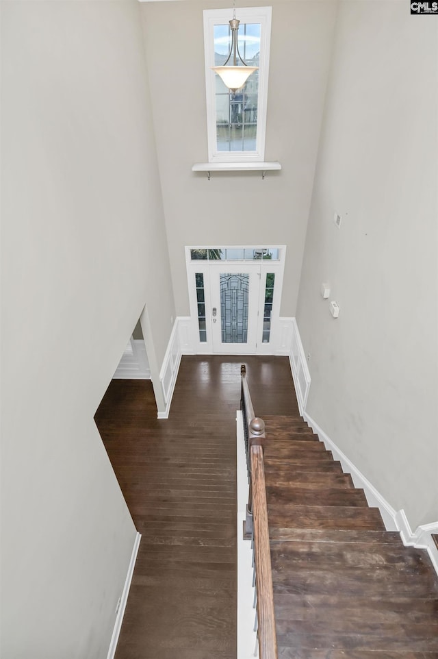 entryway with dark hardwood / wood-style flooring