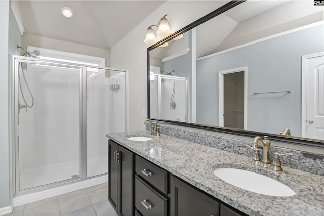 bathroom with vaulted ceiling, tile patterned floors, vanity, and an enclosed shower