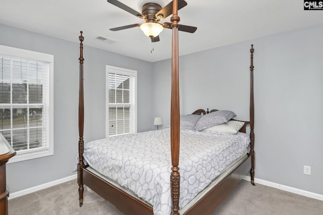 carpeted bedroom with ceiling fan