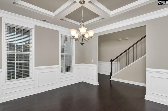 unfurnished dining area featuring coffered ceiling, dark hardwood / wood-style flooring, crown molding, and a chandelier