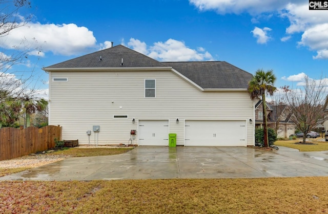 back of house with a garage