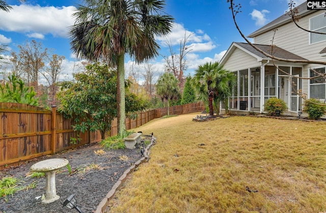 view of yard with a sunroom