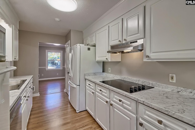 kitchen featuring dishwasher, black electric stovetop, white cabinets, and light wood-type flooring