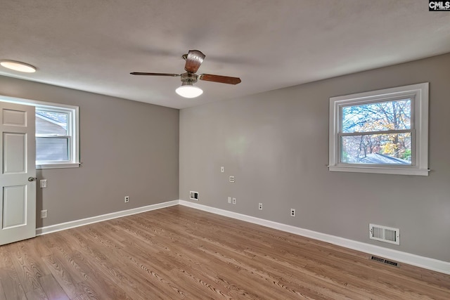 unfurnished room featuring light wood-type flooring and ceiling fan