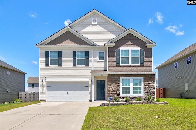 view of front of home with a front lawn and a garage